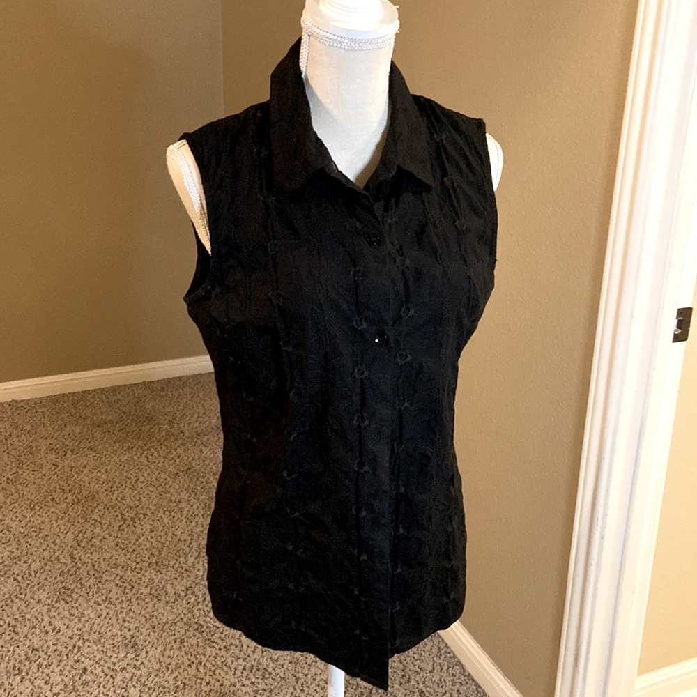 Black sleeveless blouse.